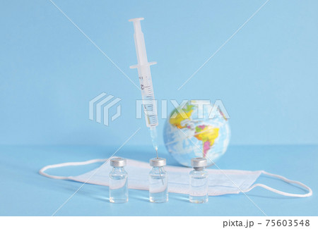 Conceptual photo for worldwide pandemic vaccination, beginning of mass vaccination for coronavirus COVID-19, influenza or flu, world immunization. Selective focus Conceptual photo for worldwide pandemic vaccination, beginning of mass vaccination for coronavirus COVID-19, influenza or flu, world immunization. Selective focus 75603548