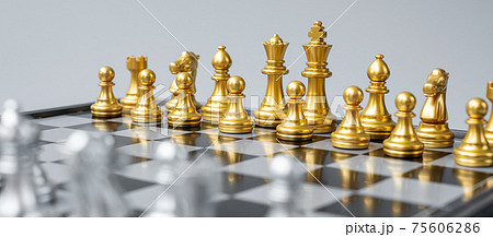 Gold Chess figure team (King, Queen, Bishop, Knight, Rook and Pawn) on Chessboard against opponent during battle. Strategy, Success, management, business planning, think, education and leader concept 75606286