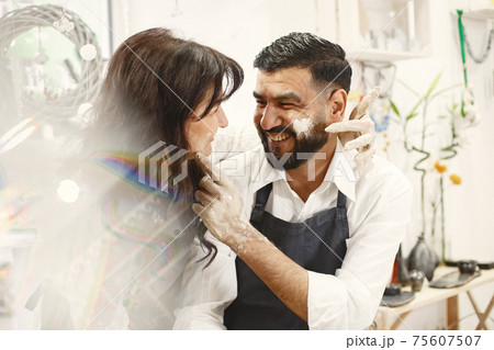 Adult mixed couple at artwork in pottery Adult mixed couple at artwork in pottery 75607507