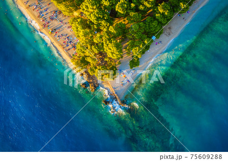 Mediterranean sea. Aerial view on the beach and people. Beach and blue water. Mediterranean sea. Aerial view on the beach and people. Beach and blue water. 75609288