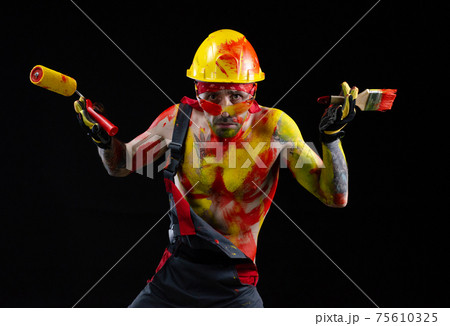 the man is a builder a painter a plasterer all in paint with a brush and a roller the man is a builder a painter a plasterer all in paint with a brush and a roller 75610325