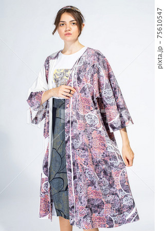 Young white woman isolated on light grey 75610547