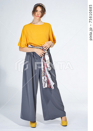 Young white girl on light grey 75610885