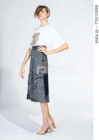 Young white woman isolated on light grey 75610886