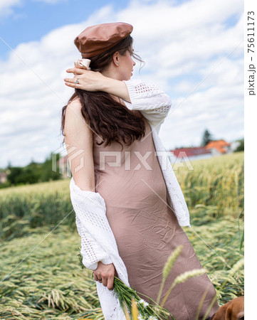 White young woman on wheat field 75611173