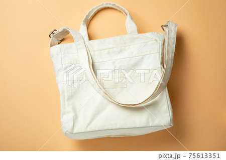 Stylish blank eco bag on beige background 75613351