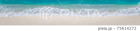 Sea waves with foam on white tropical beach. Long banner. Sea waves with foam on white tropical beach. Long banner. 75614272
