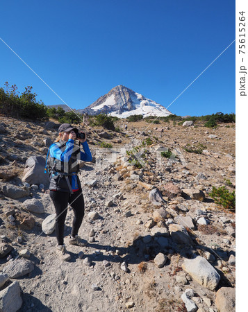 Woman on the Timberline Trail on Mount Hood, Oregon. 75615264