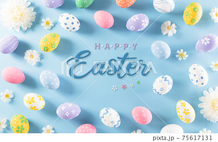 Happy easter! Colourful of Easter eggs in with flower on pastel blue background. Greetings and presents for Easter Day celebrate time. Flat lay ,top view. Happy easter! Colourful of Easter eggs in with flower on pastel blue background. Greetings and presents for Easter Day celebrate time. Flat lay ,top view. 75617131