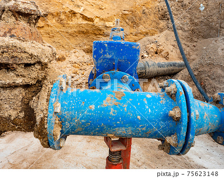 Tubes and valves. Long water line downhill from water storage tank 75623148