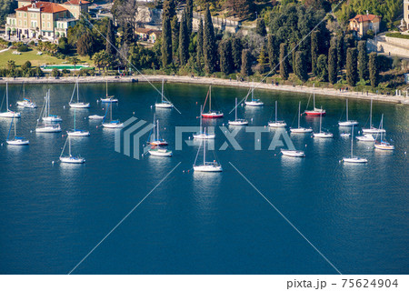 Sailing Boats moored in the Port of Garda Town - Lake Garda Veneto Italy 75624904