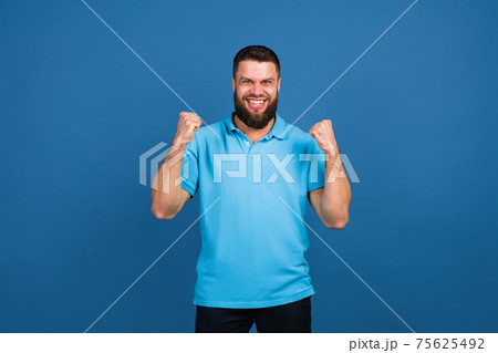 Caucasian man's portrait isolated on blue studio background with copyspace 75625492