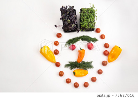 The face of a man made of sliced vegetables on a white background 75627016
