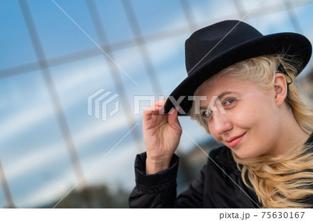 Portrait of a blonde woman wearing a Hearing Aid Portrait of a blonde woman wearing a Hearing Aid 75630167
