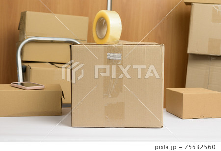 lot of brown cardboard boxes, the process of packing things when moving 75632560