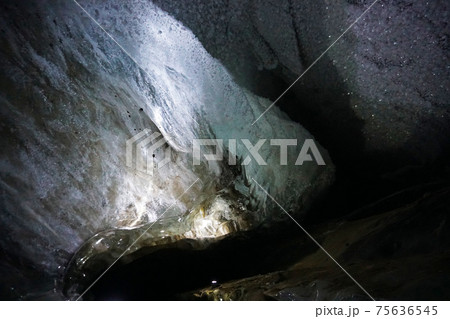 In an ice cave with colored lighting from lanterns In an ice cave with colored lighting from lanterns 75636545