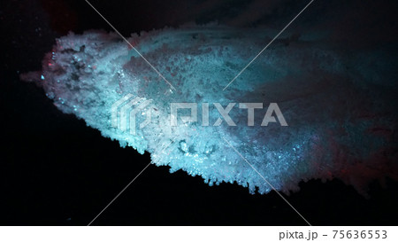 In an ice cave with colored lighting from lanterns In an ice cave with colored lighting from lanterns 75636553