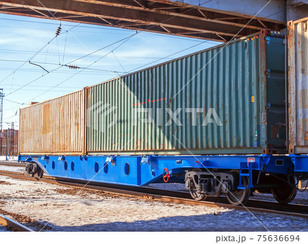 A 80-fts Idler flatcars with a two of intermodal 40-fts long containers on the marshalling yard of Trans-Siberian Railway. A 80-fts Idler flatcars with a two of intermodal 40-fts long containers on the marshalling yard of Trans-Siberian Railway. 75636694