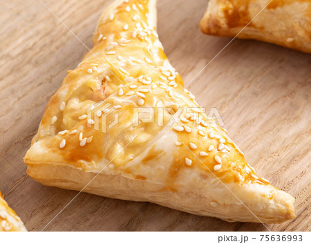 Golden crispy slices with ham and cheese on wooden kitchen board, close-up. Homemade Golden crispy slices with ham and cheese on wooden kitchen board, close-up. Homemade 75636993