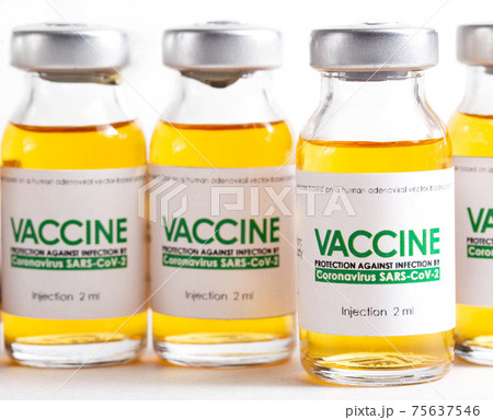 Looped. Flasks of vaccine for COVID-19 coronavirus in research lab. Vaccination, injection, clinical trial during pandemic, macro Looped. Flasks of vaccine for COVID-19 coronavirus in research lab. Vaccination, injection, clinical trial during pandemic, macro 75637546