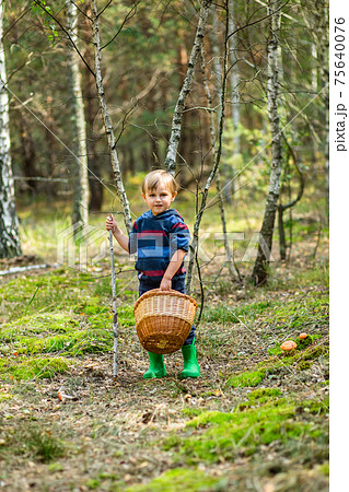 Children walk in the forest with canes. Children walk in the forest with canes. 75640076