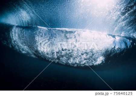 Underwater ocean wave. Transparent water and breaking barrel wave 75640125