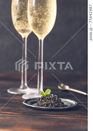 Black caviar with champagne 75642987