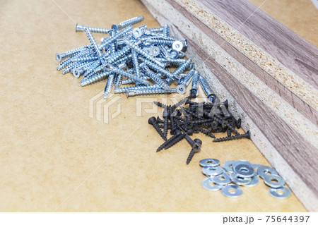 Screw-on for furniture. Metal screw. Vertical. Metal screws. Furniture fittings and fittings. Stainless steel. Realistic. 75644397