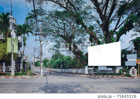 White advertising board on building in city. 75645526