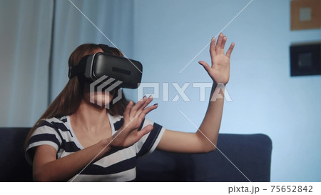 virtual reality. young a girl in 3d glasses watches video 360 dream. to watch online video games gadget. girl in virtual reality glasses. fun kid dream. new digital technologies stay at home virtual reality. young a girl in 3d glasses watches video 360 dream. to watch online video games gadget. girl in virtual reality glasses. fun kid dream. new digital technologies stay at home 75652842
