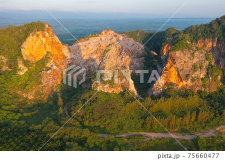 Khao Kuha at Songkhla. Mountain hill with green forest trees. Nature landscape background in Thailand. Huangshan mountain. Khao Kuha at Songkhla. Mountain hill with green forest trees. Nature landscape background in Thailand. Huangshan mountain. 75660477