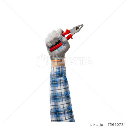 hand holds a construction tool pliers hand holds a construction tool pliers 75660724