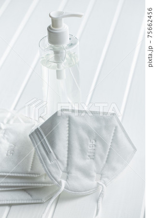 Coronavirus prevention hand sanitizer and kn95 respirator mask. Hand disinfectant gel in pump bottle. Coronavirus prevention hand sanitizer and kn95 respirator mask. Hand disinfectant gel in pump bottle. 75662456
