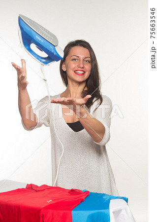 Woman throw up an iron Woman throw up an iron 75663546