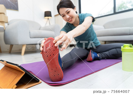 Woman exercise at home Woman exercise at home 75664007