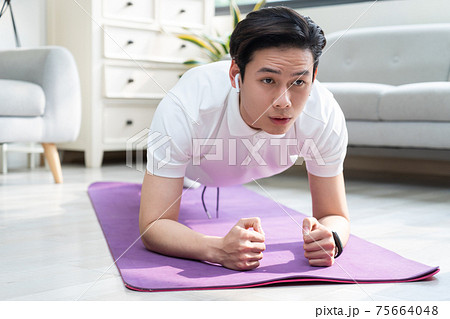 Man exercise at home Man exercise at home 75664048