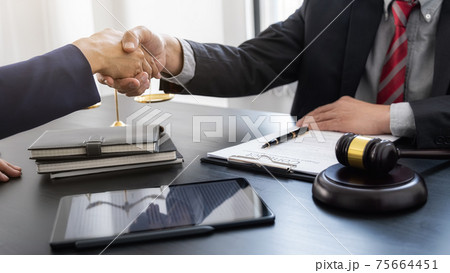 Professional lawyer advising a client on commercial contract legal in service office. Justice, Law, Attorney and Court judge concept. Professional lawyer advising a client on commercial contract legal in service office. Justice, Law, Attorney and Court judge concept. 75664451