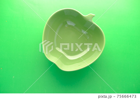 empty bowl on green background top down empty bowl on green background top down 75666473