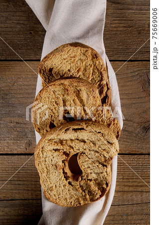 Italian appetizer Friselle. Apulian dried bread Friselle in wooden background 75669006