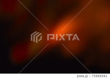 colorful warm rainbow light leaks on black background with dust texture 75669381