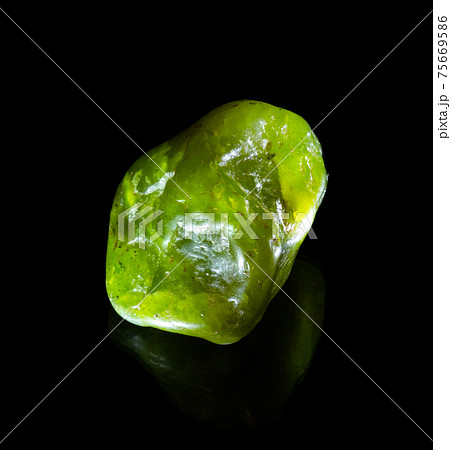 Raw green nephritis jade mineral nugget from Austria isolated on black background. For geology mineralogy magazines websites article, Natural Science museum wall charts and posters etc 75669586