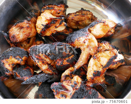 Pieces of chicken that have been grilled and ready to serve. Has been seasoned and marinated with special spices before being grilled. Pieces of chicken that have been grilled and ready to serve. Has been seasoned and marinated with special spices before being grilled. 75670601