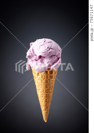 Ice cream in waffle cone. Ice cream in waffle cone. 75671147