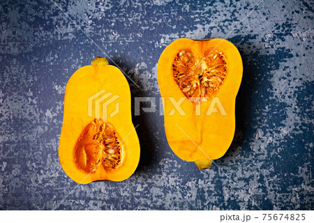 Pumpkin sort Butternut squash on grunge blue background. Pumpkin sort Butternut squash on grunge blue background. 75674825