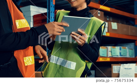 Female warehouse worker working at the storehouse Female warehouse worker working at the storehouse 75675334