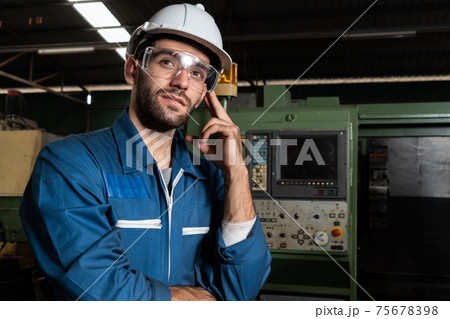 Skillful factory engineer or worker portrait while thinking and looking forward Skillful factory engineer or worker portrait while thinking and looking forward 75678398