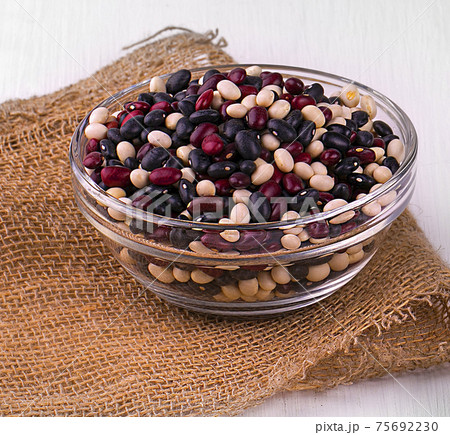 Coloreful haricot bean on the glasses plates. 75692230