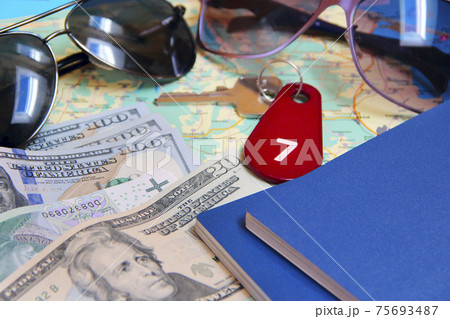 money passport and villa keys. Travel concept. Things collected for travel money passport and villa keys. Travel concept. Things collected for travel 75693487