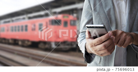 Businessman use smartphone for booking a ticket. Businessman use smartphone for booking a ticket. 75696013