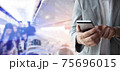 Businessman use smartphone for booking a flight ticket. 75696015